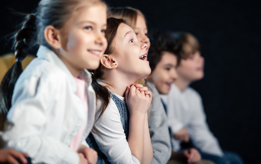 Kids watching movies during a move marathon event