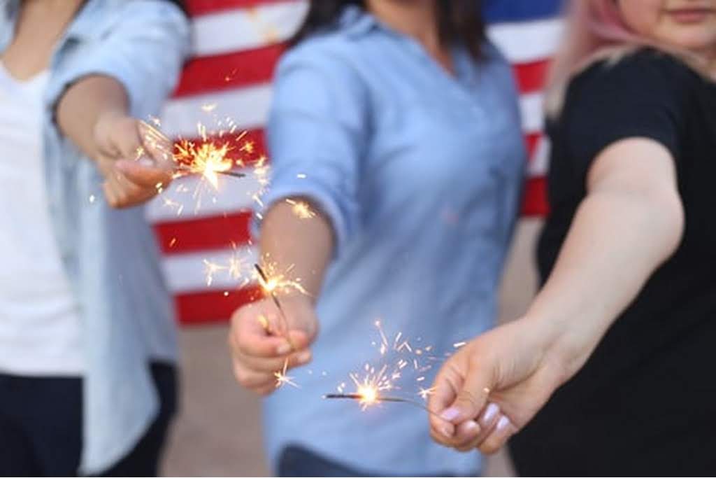 3 kids with sparkling candles