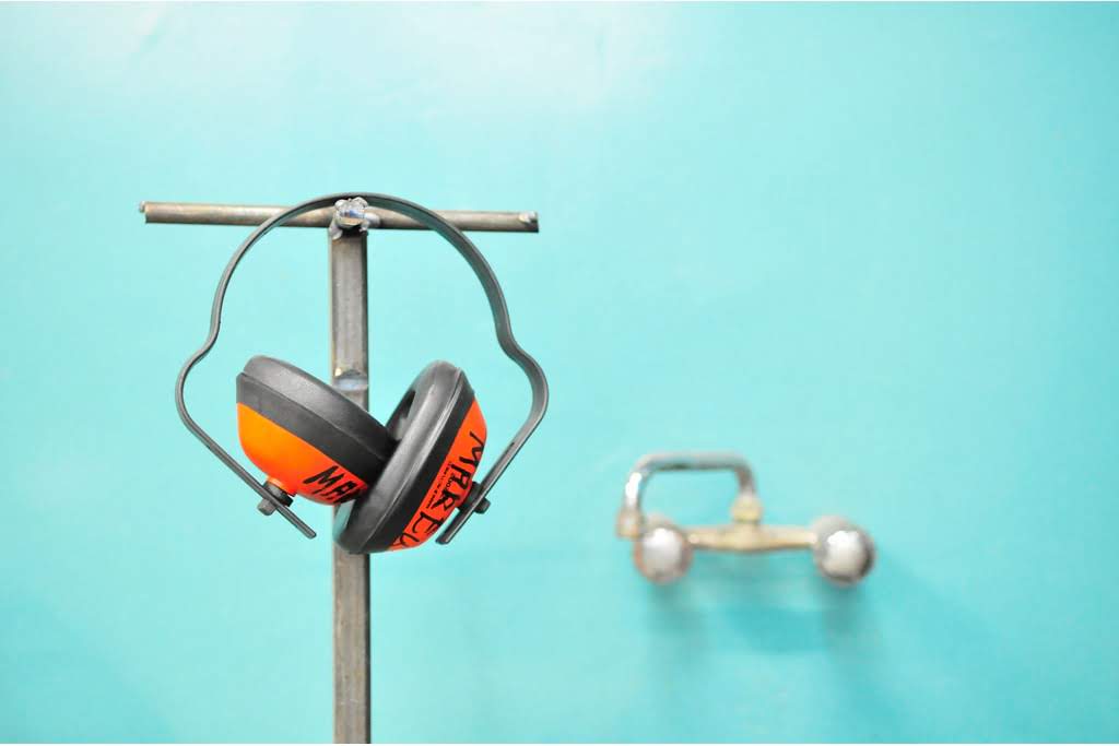 A pair of noise-cancelling headphones on a stand headphones on a stand
