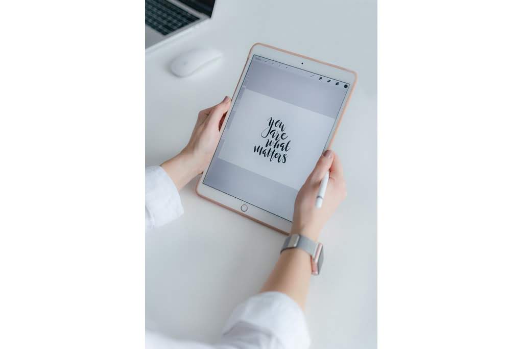 An ipad with the text "you are what matters" iPad with graphic designs