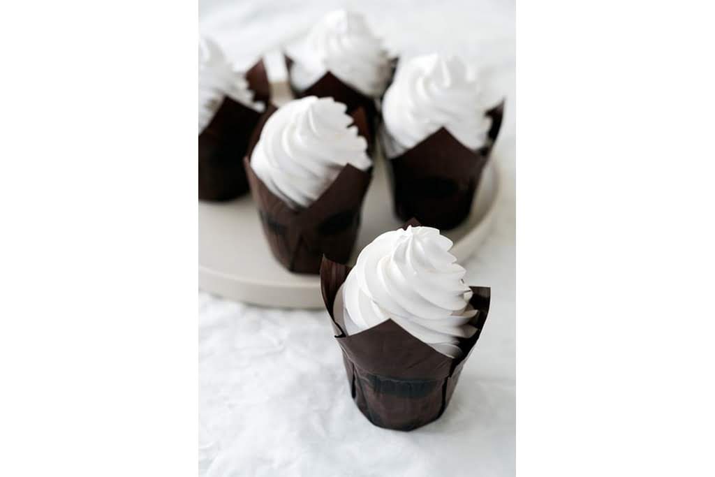 Black cupcakes with white frosting white cupcakes