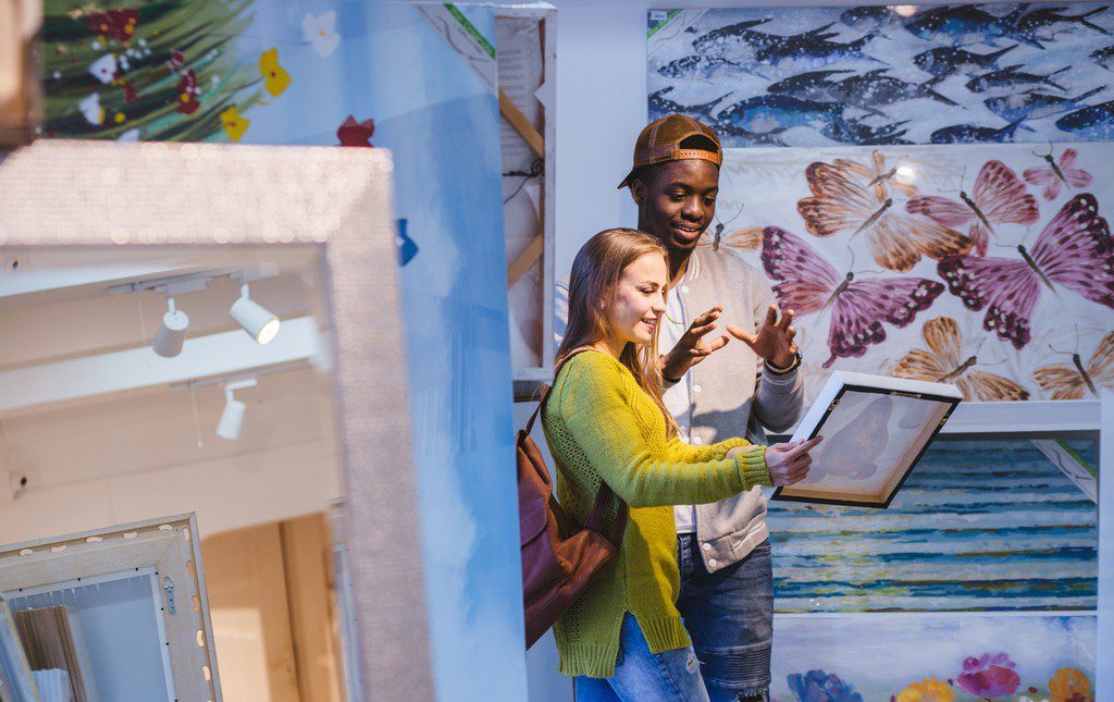 teens looking at art at an art show