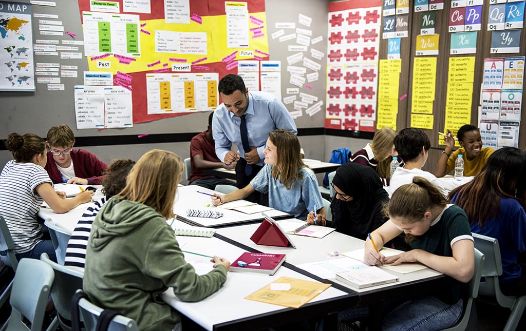 Students and their teacher in class