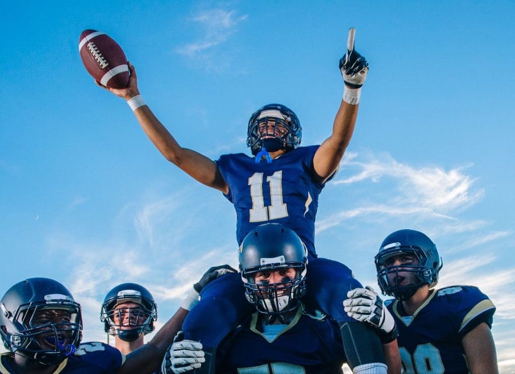 High School football players celebrating a big touchdown