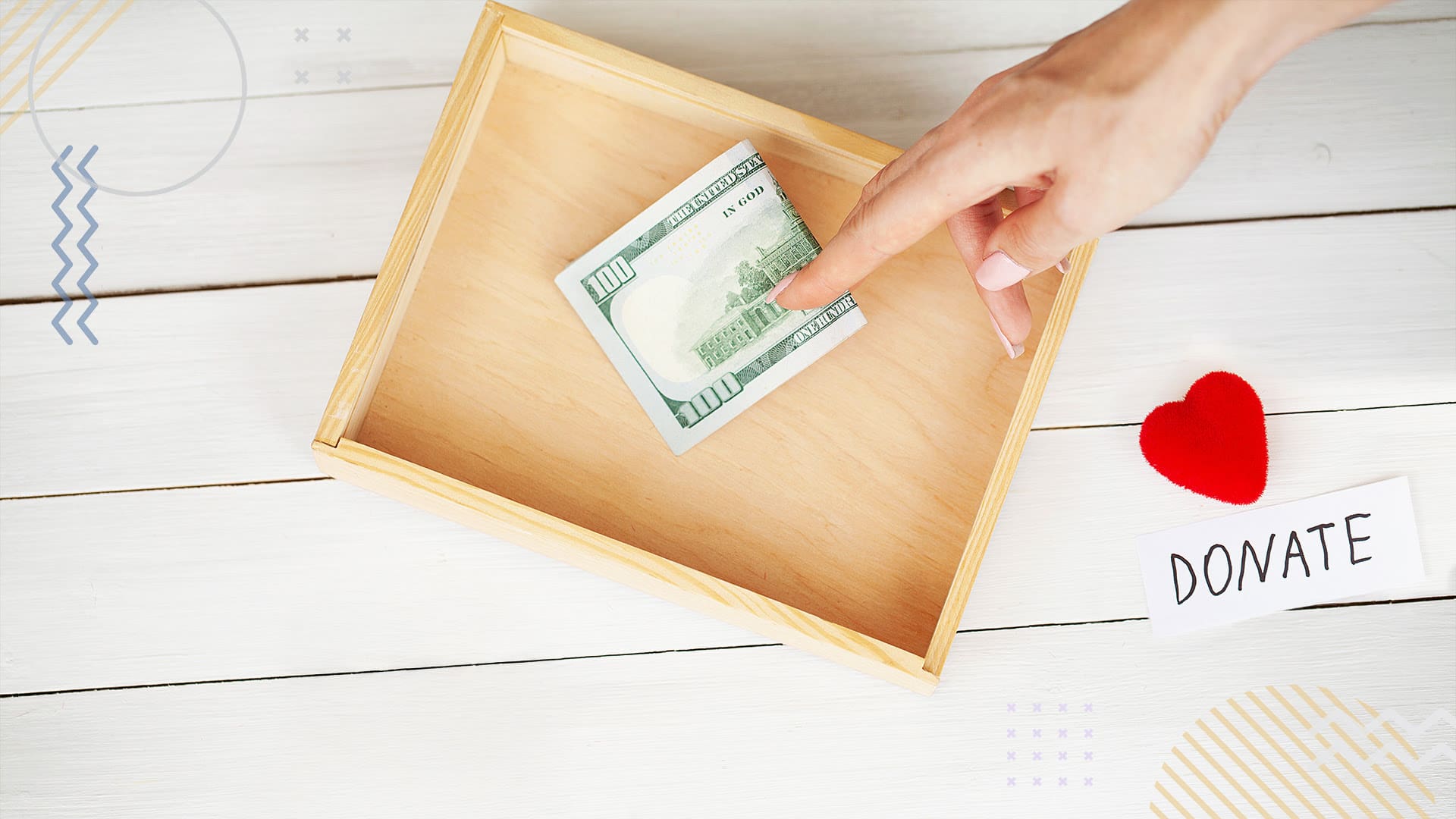 Person sliding a dollar bill on top of a donation envelope