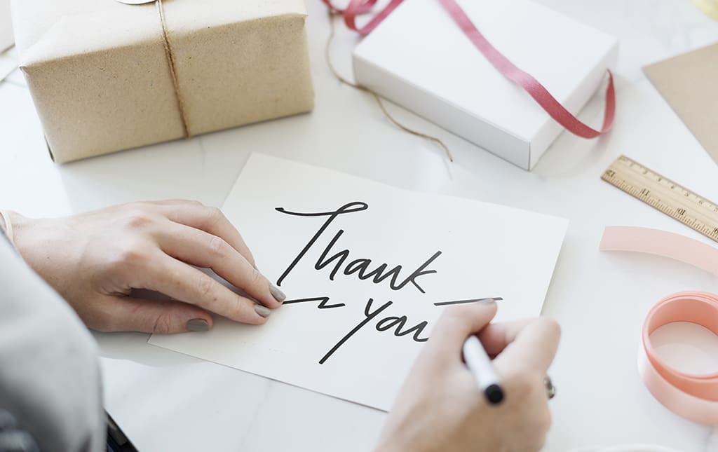 A high school administrator writes a thank you letter to a donor