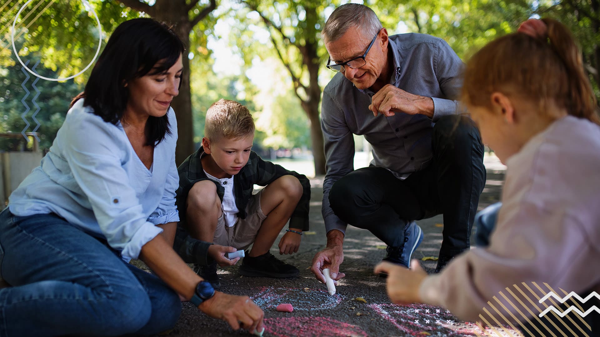 Young students drawing on pavement with chalk with grandparents