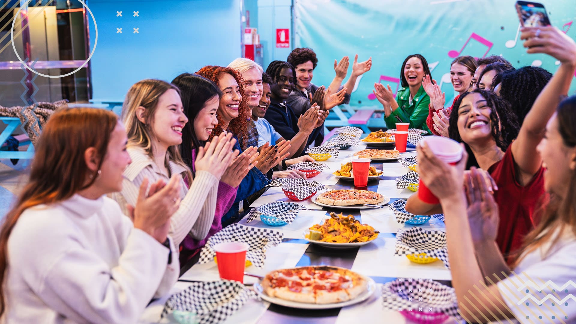 Group of people celebrating and smiling at an end of season team party