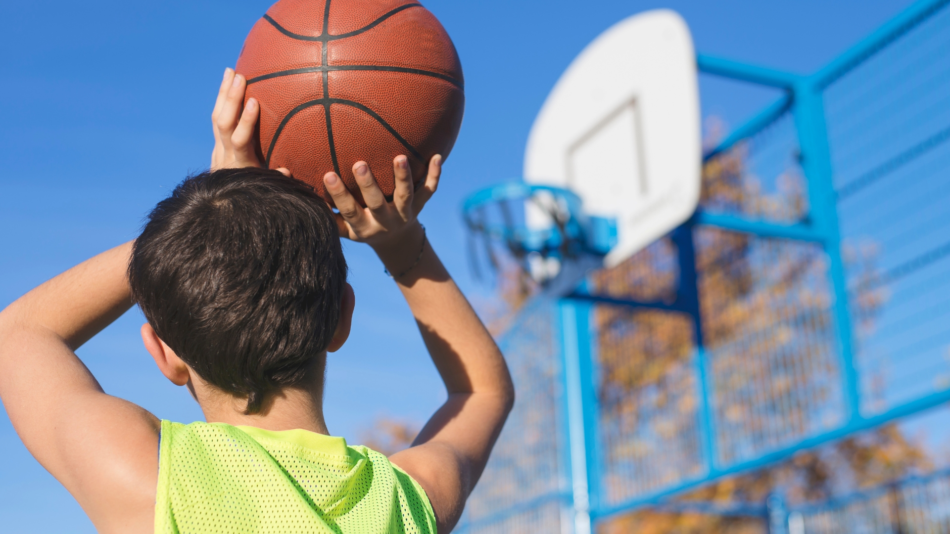 child shooting hoops for a school fundraiser