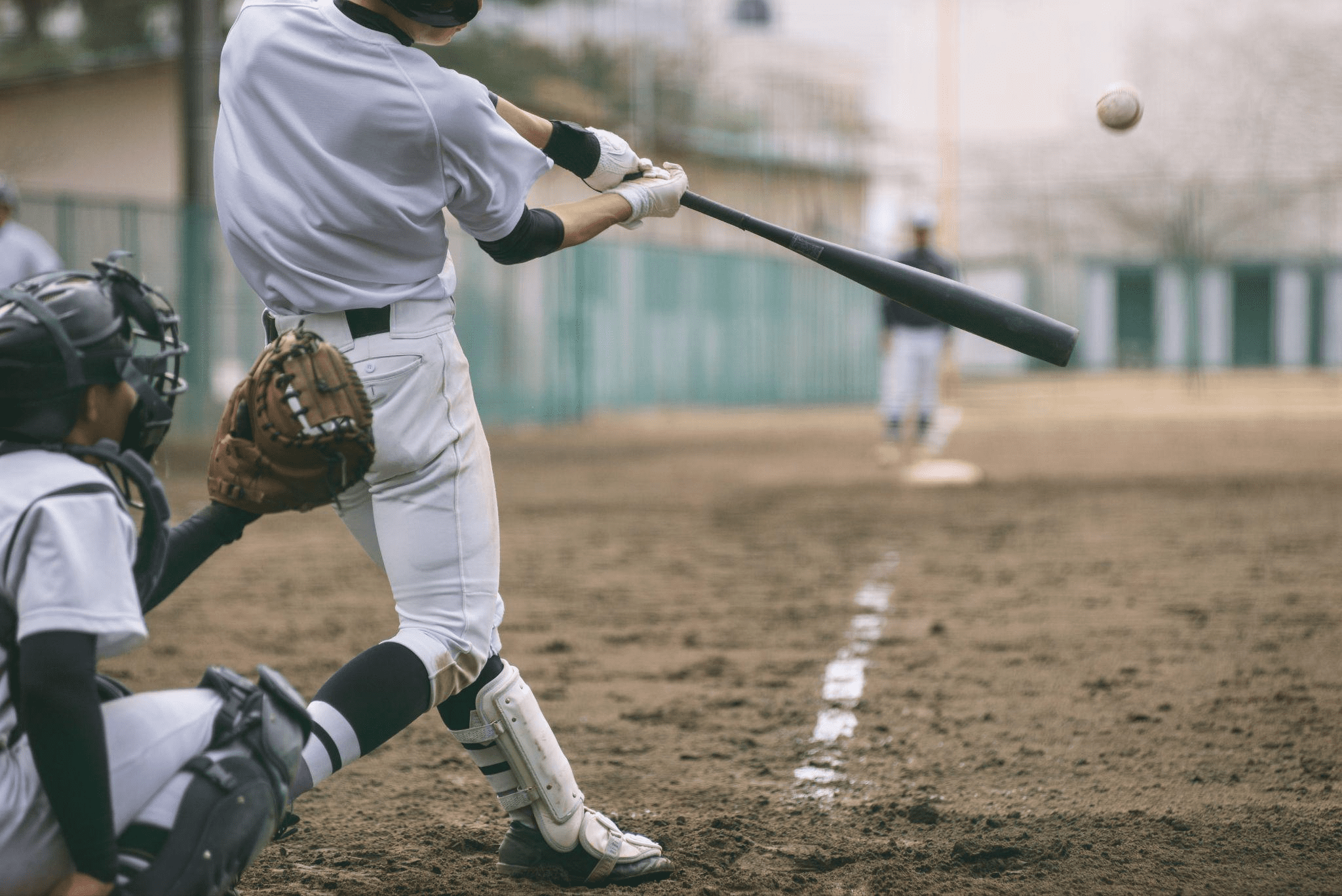 Baseball player hitting a ball during an A-Thon