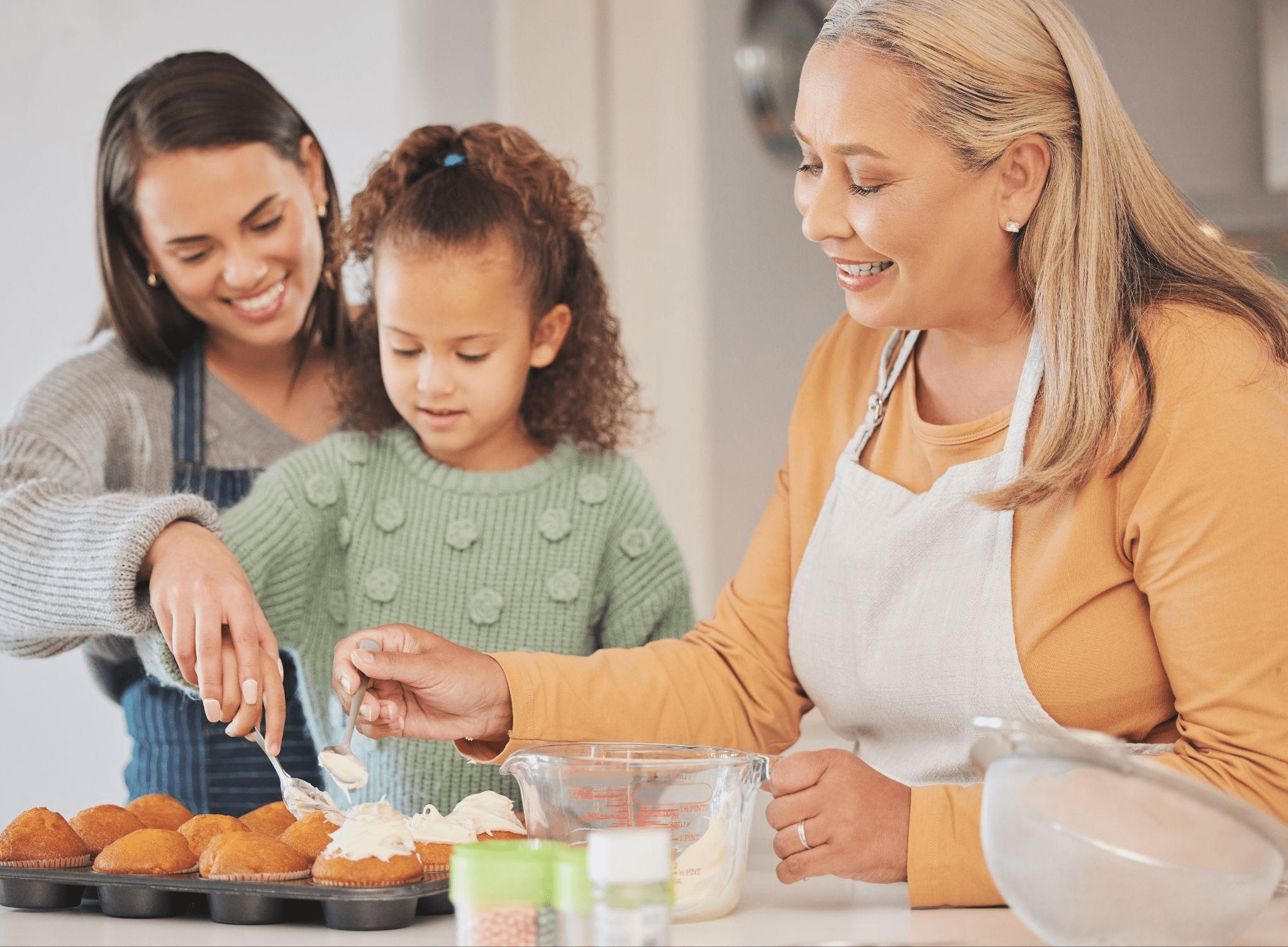 Family decorating cupcakes